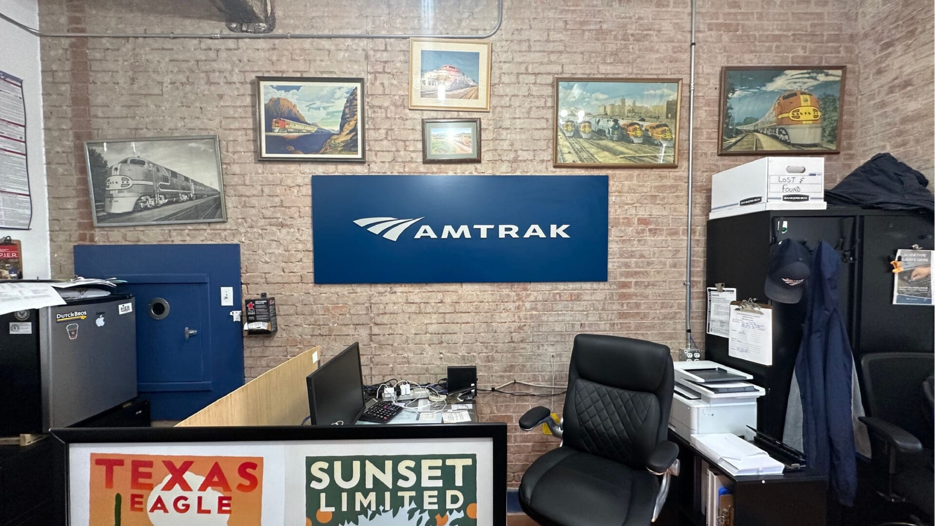 Black chair near Amtrak sign and lockers