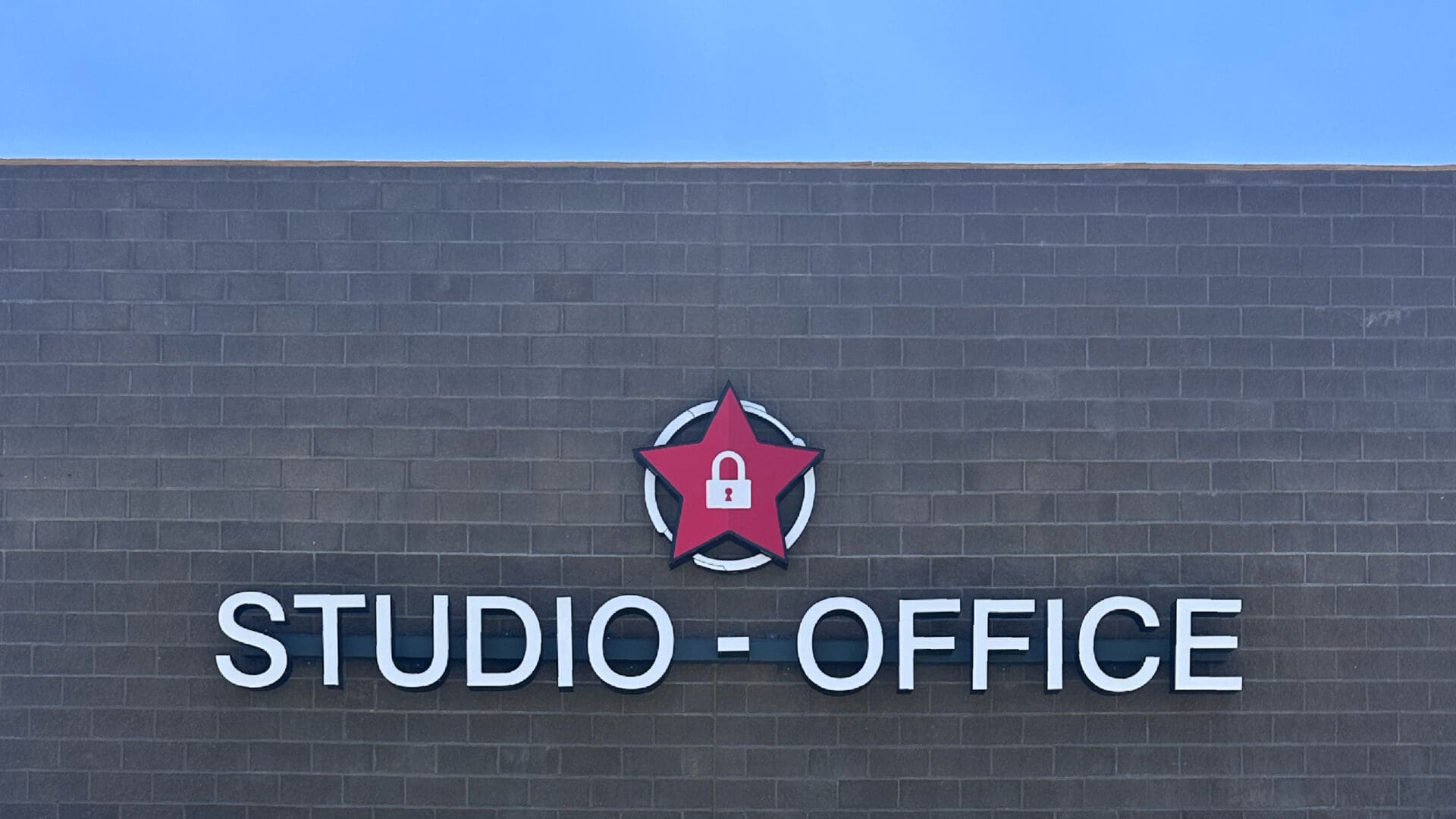Studio office sign with red padlock star