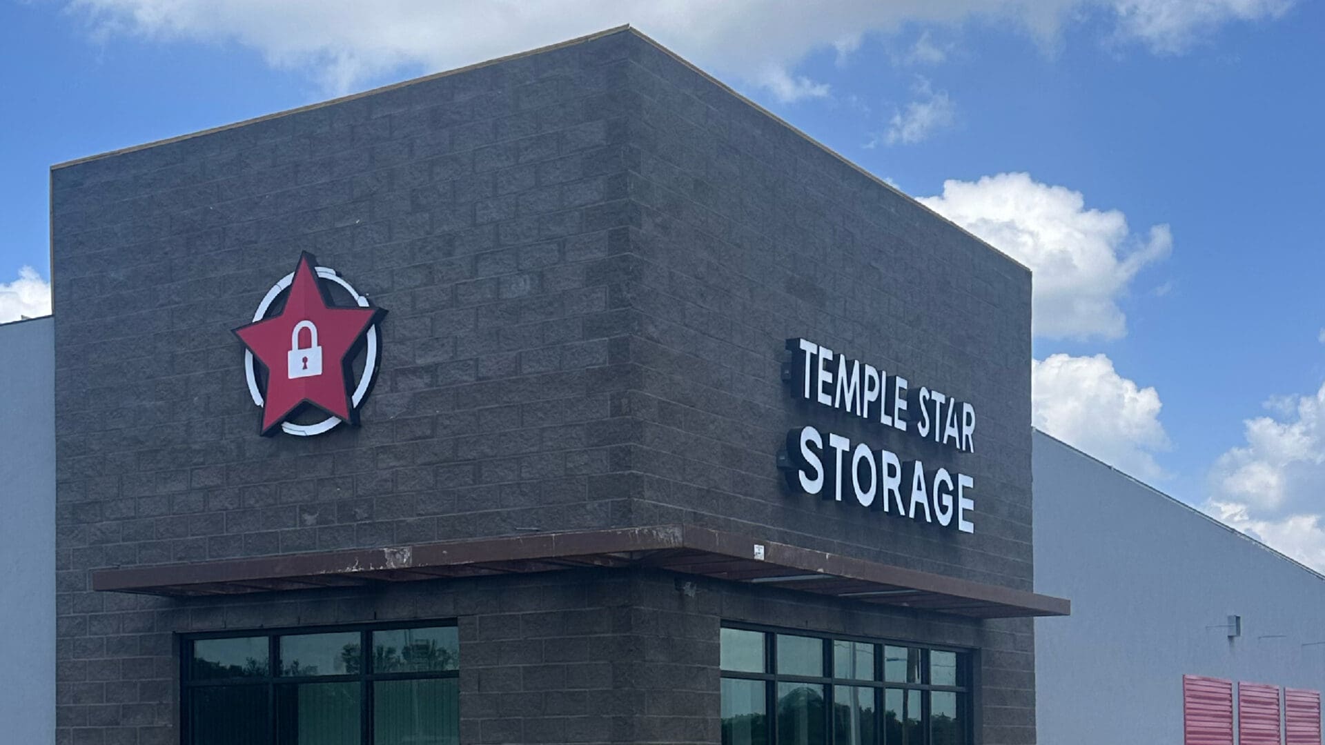 Temple Star Storage building with red star logo