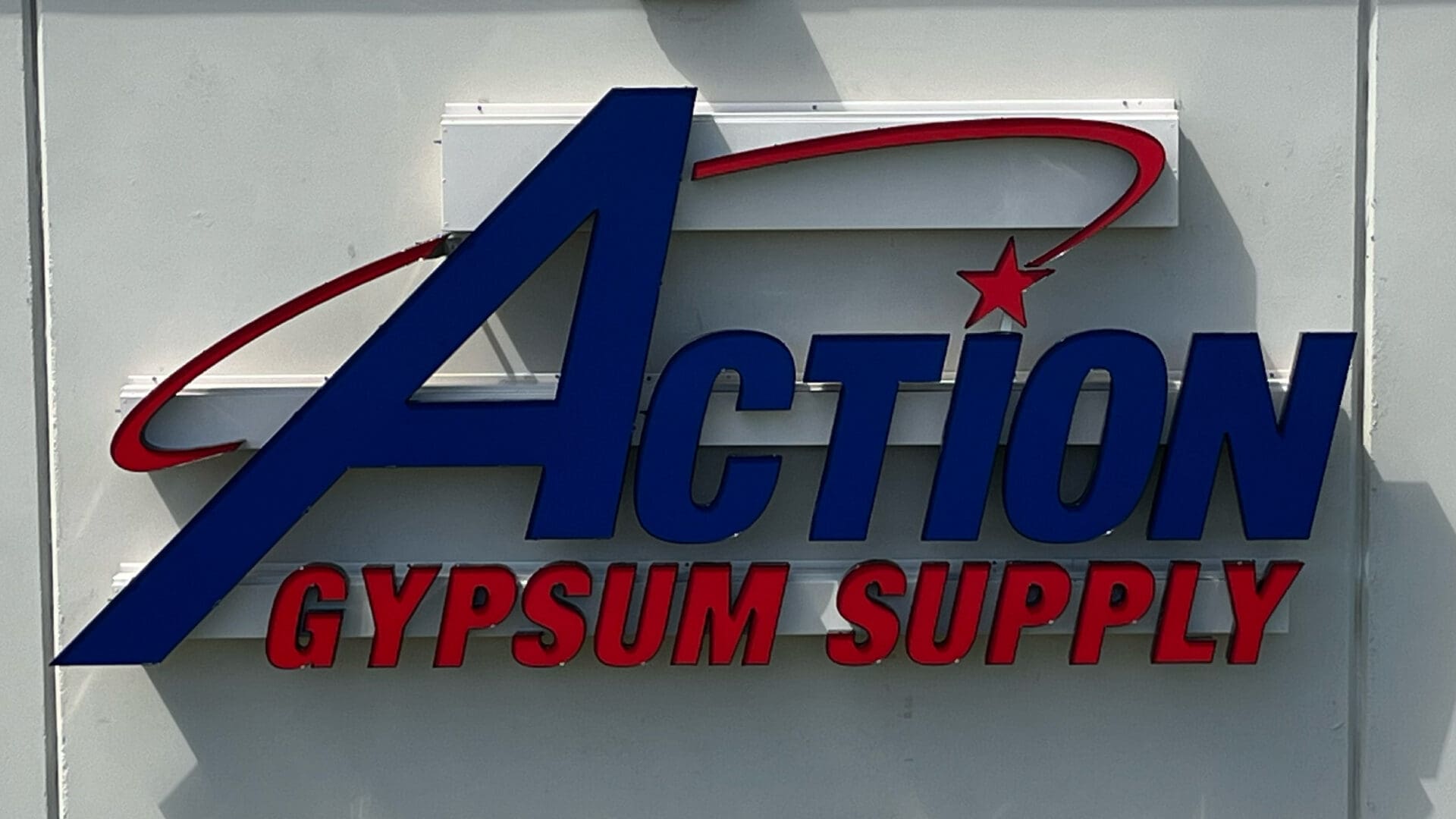 Blue Action Gypsum Supply storefront sign