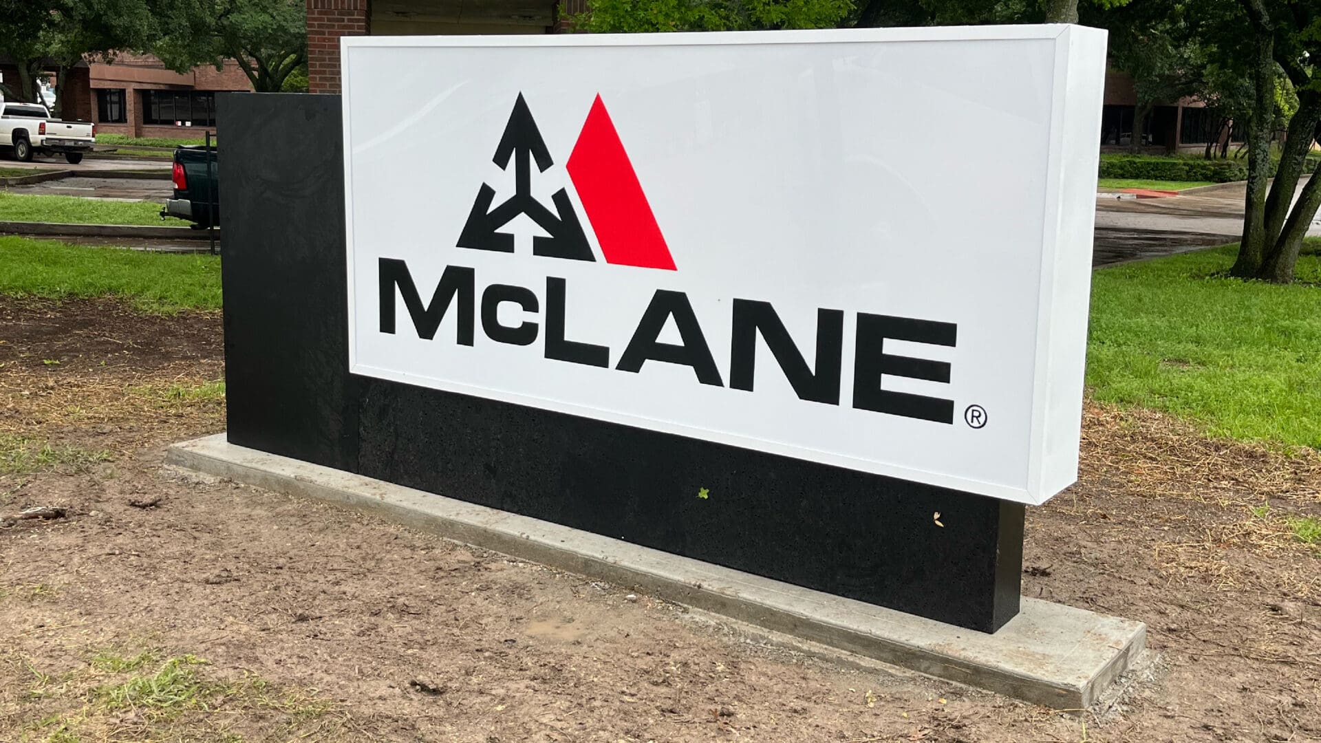 McLane logo sign with red triangle