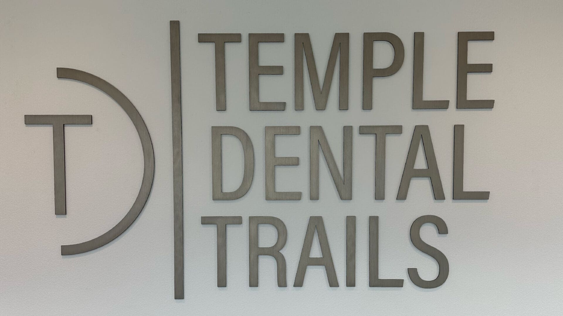 Large interior sign reading TEMPLE DENTAL TRAILS
