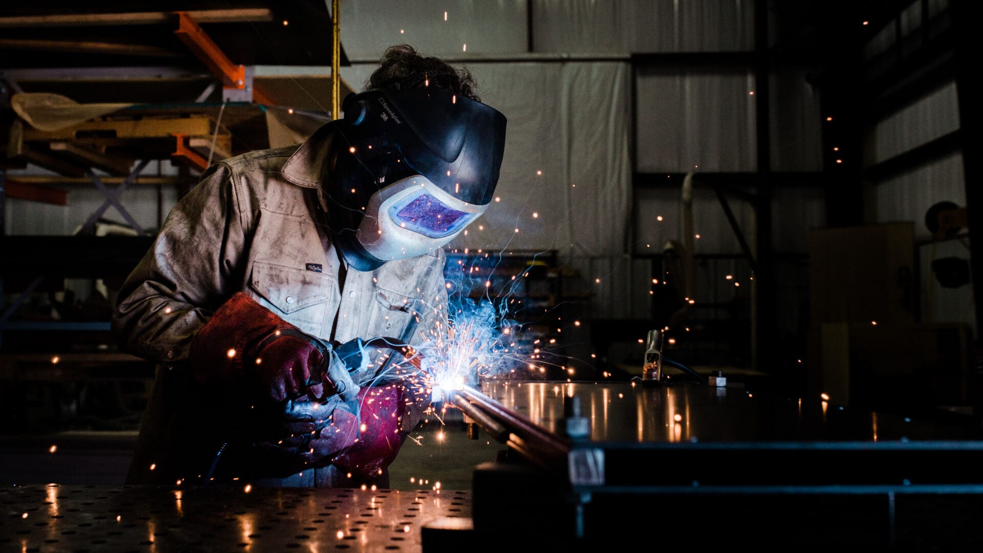 Close-up of industrial welder at bench
