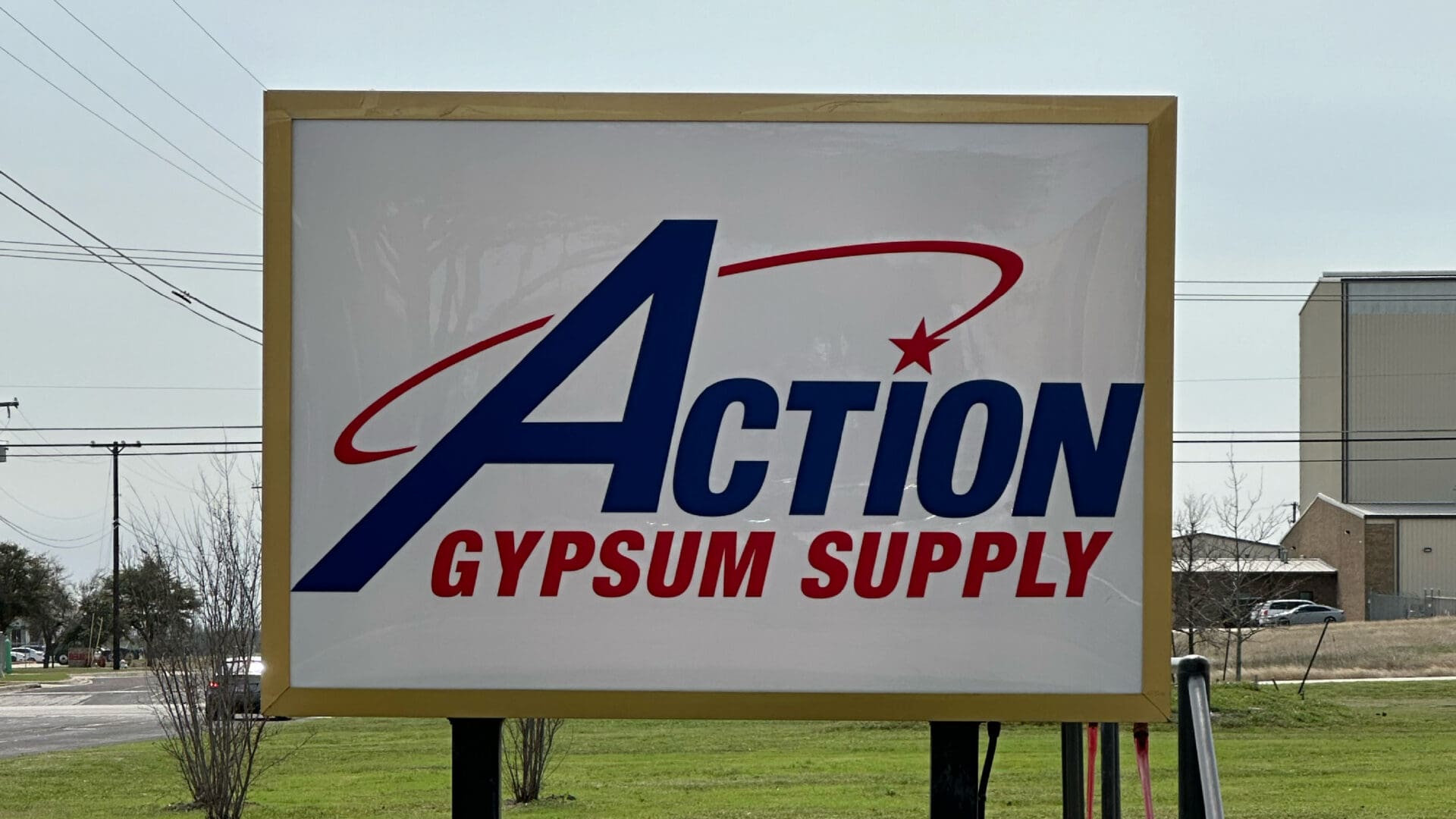 Action Gypsum Supply storefront sign with logo